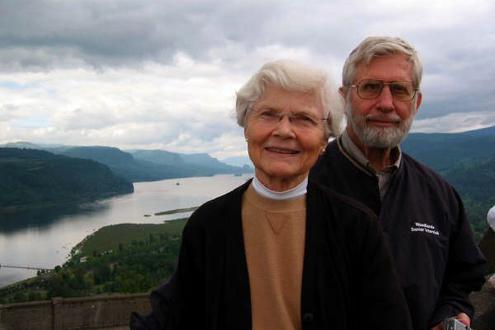 Picture of Sandy and Billy Ashby in their elderly years with a beautiful nature background