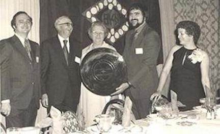 Black and white image of Clinton Hartmann at an IEEE award ceremony.